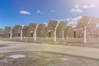 a row of solar panels on the ground of a solar park in the desert setting