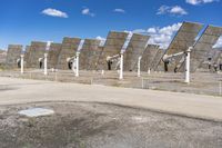 a row of solar panels on the ground of a solar park in the desert setting