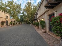 the courtyard of a small old country town house in the afternoon with the sky in the background