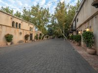 the courtyard of a small old country town house in the afternoon with the sky in the background