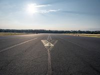 a small plane is about to take off from an airport runway on a sunny day