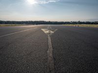 a small plane is about to take off from an airport runway on a sunny day