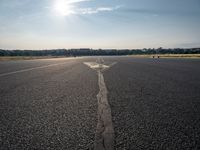 a small plane is about to take off from an airport runway on a sunny day