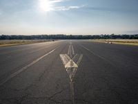 a small plane is about to take off from an airport runway on a sunny day