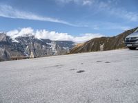 a bench is shown in front of some snow - capped mountains and a valley with rocks