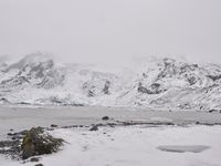 a large glacier with many melting pieces on it's surface, including small mountains