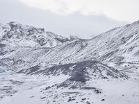 a large glacier with many melting pieces on it's surface, including small mountains