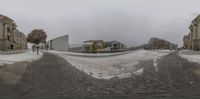 a blurry view of a large building with a snow covered slope in front of it