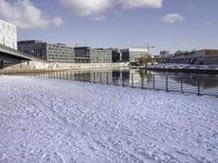 there is snow on the ground outside the buildings of an area with white snow and a blue sky