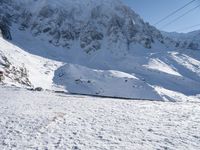 Snow-Covered Mountain in the Alps: A Clear Sky Above