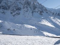 Snow-Covered Mountain in the Alps: A Clear Sky Above