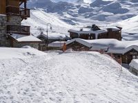 snow is covering the ground and the stairs are made to hold the skis on