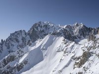 a person on skis goes down a snowy mountain slope side with some very majestic snow