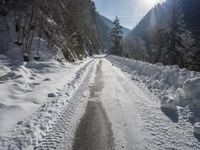 Snow-Covered Mountains and Straight Road in the Swiss Alps