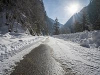Snow-Covered Mountains and Straight Road in the Swiss Alps