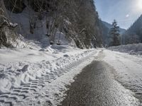 Snow-Covered Mountains and Straight Road in the Swiss Alps