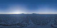 a photograph taken from a plane with snow and mountains in the background for a 360 - camera effect