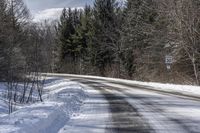 Snow Covered Road in Forest, Canadian Landscape