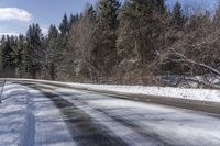 Snow Covered Road in Forest, Canadian Landscape