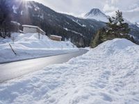 a road with lots of snow on it and a person riding a red skis