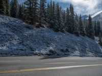 the mountains and snow have been cleared on a road in canada's rocky mountains