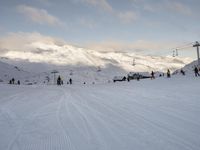 Snow Covered Slope in the Alps under a Clear Sky