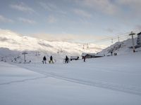 Snow Covered Slope in the Alps under a Clear Sky