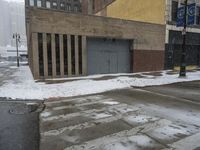 a street pole sitting on top of snow covered ground near tall buildings in the city