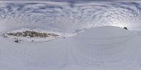 a snow boarder is making his way down a snowy hill on his snowboard