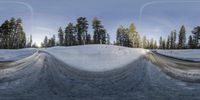 a snowboarder is midair on a ramp of a course covered in snow