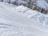 there is snow everywhere that has been cleared off the road with ski equipment on it