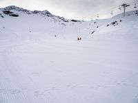 Snowy Alps Landscape Under a Gloomy Sky