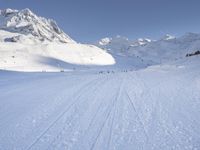 Snowy Alps: A Mountain Range under a Clear Sky