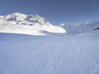 Snowy Alps: A Mountain Range under a Clear Sky