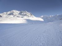 Snowy Alps: A Mountain Range under a Clear Sky