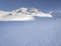 Snowy Alps: A Mountain Range under a Clear Sky