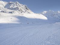 Snowy Alps: A Mountain Range under a Clear Sky