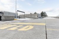 an intersection in the snow with one side showing and the other showing yellow painted on it