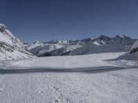 there are tracks of snow left by skiers on the slopes in this snowy area