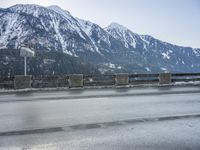 Snowy Road in Germany: Asphalt and Water Reflection