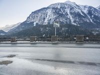 Snowy Road in Germany: Asphalt and Water Reflection