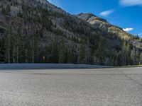 Snowy Road in Colorado: A Forest Surrounded by Mountains