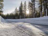 a long country road is covered with snow and has a person riding a ski on it