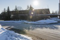 Snowy Road: Residential Buildings and Trees in Ontario