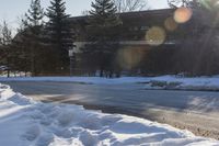 Snowy Road: Residential Buildings and Trees in Ontario