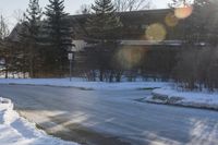 Snowy Road: Residential Buildings and Trees in Ontario