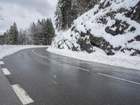 Snowy Road through Mountains