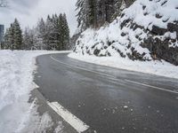 Snowy Road through Mountains