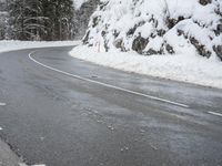 Snowy Road through Mountains
