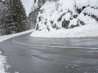 Snowy Road through Mountains